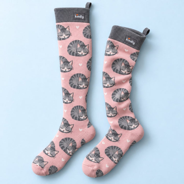 Cat Nap Kindly knee-high compression socks, grey sleeping cats on soft pink, with the pull loop at the back of the cuff