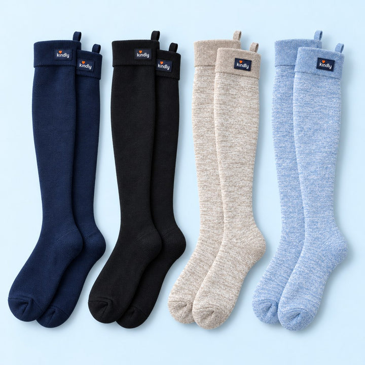 Studio flat lay of four pairs of Kindly Everyday Solids knee-high compression socks side by side