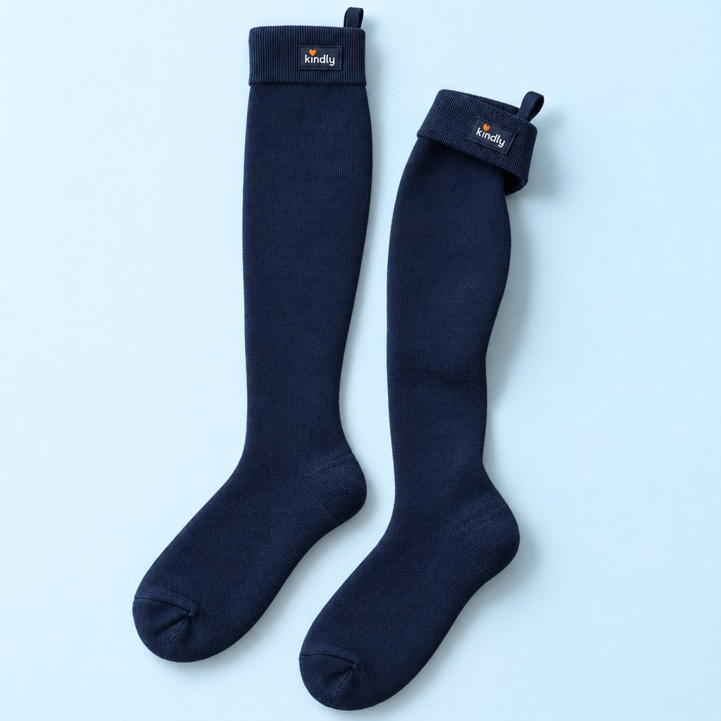 Studio flat lay of one pair of Kindly Everyday Solids knee-high compression socks in Navy