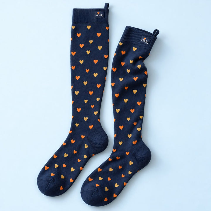 Heart of Gold Kindly knee-high compression socks, little orange and gold hearts on navy, with the pull loop at the back of the cuff