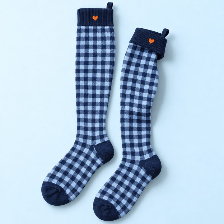 Studio flat lay of one pair of Kindly Picnic Check knee-high compression socks
