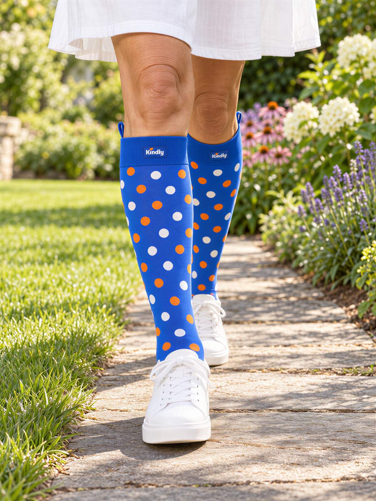 Polka Pop Kindly compression socks worn knee-high