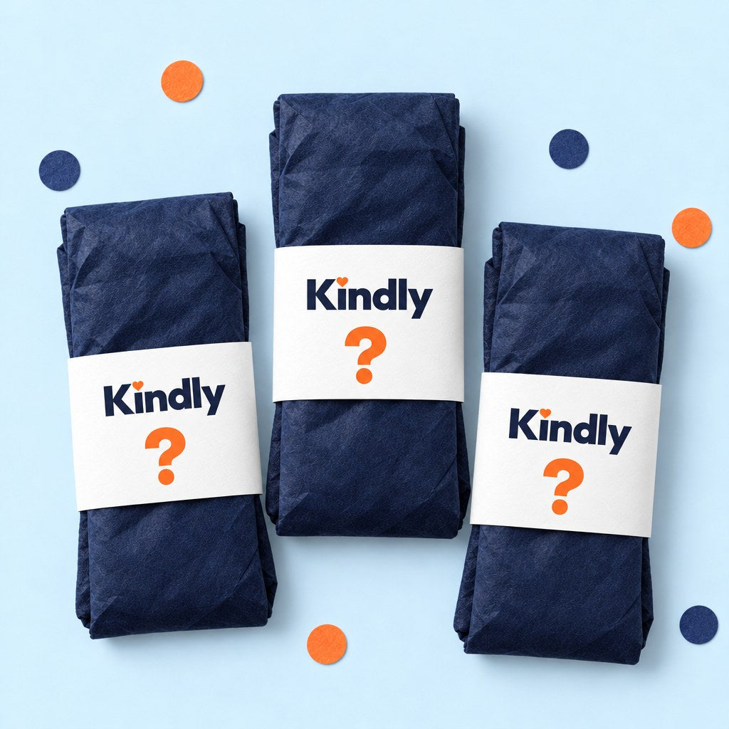 Three folded sock pairs wrapped in navy tissue, each with a white Kindly belly band showing a big orange question mark